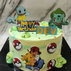 Gotta catch 'em all! This Pokémon cake for Dev's birthday was so much fun to create. It features Ash, Pikachu, Squirtle, and Bulbasaur on a yummy vanilla cake, ready for a Pokémon battle.
