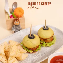 Our Mexican Cheesy Sliders are a big hit! These mini burgers are perfectly sized for little hands and come with a side of crispy snacks.