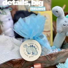 The little details are where the feelings live. This close-up shows a custom tag from the dinosaur-themed hamper, with the message "Rawr means I love you," adding a layer of sweetness to the gift.