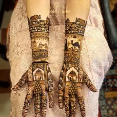 A customized bridal mehendi for a gorgeous bride from Dubai, featuring traditional Rajasthani elements like camels, palaces, and elephants. This design is a perfect blend of cultural heritage and personal storytelling.