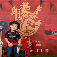For the little cricket fan! We created this awesome Royal Challengers Bangalore (RCB) theme for a young supporter, complete with the team jersey, logo, and cricket gear.