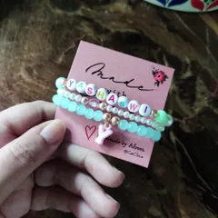 A personalized stack of three bracelets for Yashaswi, beautifully presented on our "Made with Love" card. The initial charm adds an extra special touch.