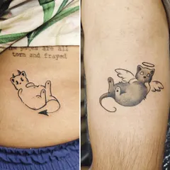 Couple tattoo goals for pet lovers. One gets the angel cat, the other gets the devil cat, showing their fun and playful dynamic.