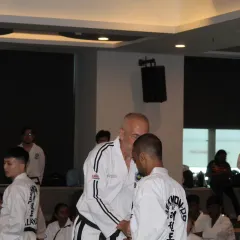 Receiving guidance from a Grand Master during an International Instructor Course (IIC). Direct feedback from the world's best is invaluable for growth.