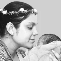There is nothing more powerful than a mother's love. This black and white portrait focuses on the quiet, tender connection between a new mother and her baby, a timeless memory captured forever.