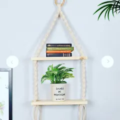 For those with limited floor space, I recommend creative solutions like this macrame hanging shelf. It's a stylish way to display small plants and books, adding a touch of bohemian charm to any room.