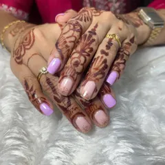 Another view of the lavender and nude glitter gel polish on natural nails. It's a soft and elegant color combination that is perfect for daily wear.