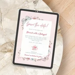 A sweet and delicate Save the Date for a baby girl's arrival. Displayed on a tablet, this digital design uses soft pinks, watercolor butterflies, and florals to announce the magical news.