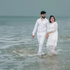 A simple, romantic walk along the shore. We capture the natural interaction between a couple, with the waves and the sea creating a perfect, serene backdrop for their love story.