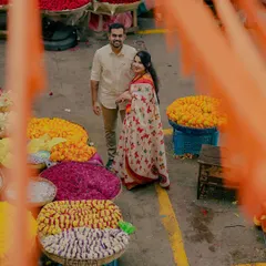An overhead shot capturing the vibrant colors of KR Flower Market in Bangalore. I framed the couple amidst the flower baskets to create a unique and lively portrait that tells a story of love blooming in the city.