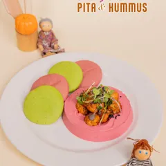 A healthy and colorful treat of Pita & Hummus. We make our hummus with beetroot for a fun pink twist that kids love.