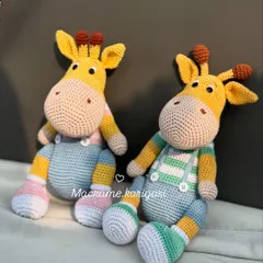 A different angle of our handmade crochet giraffes. Standing at about 11.5 inches tall, they are a substantial size for playtime and make a beautiful statement piece in a nursery.