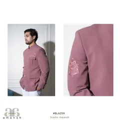 A diptych showing both a side profile and a close-up of the sleeve embroidery on our pink Prince Coat. This highlights the jacket's sharp tailoring and the delicate, tonal floral artwork.