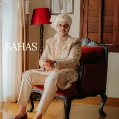 A classic portrait of the groom, Sahas, looking relaxed and happy. Capturing these quiet, confident moments before the ceremony is key to telling the whole story.