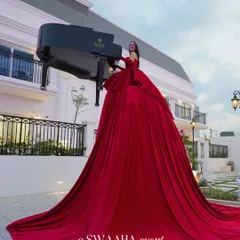 I believe entertainment should be a spectacle. This performer, playing a grand piano from within a flowing crimson gown, is an example of the unique, show-stopping experiences I curate to make your celebration truly extraordinary and leave guests in awe.