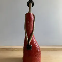 Titled "Damn Red Woman," this powerful sculpture was made by a student to symbolize resilience. The vibrant red glaze and the subtle cracks in the form tell a story of strength, pain, and unbroken beauty.