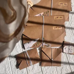 A whole batch of love, ready to be sent out! These are my vintage-style handwritten letters, all sealed and tied with string. It's old-school love in a modern world.