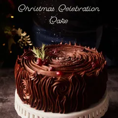 Our Christmas Celebration Cake is a showstopper. This rich chocolate cake is decorated with beautiful buttercream swirls to resemble tree bark, and garnished with fresh cranberries and rosemary for a festive touch.