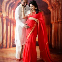 Celebrating our beautiful traditions. This couple chose to honor their roots with a classic maternity photoshoot in elegant ethnic wear, set against a backdrop that evokes timeless Indian artistry.
