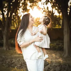 There's nothing like the soft, dreamy glow of the golden hour for an outdoor family photoshoot. This beautiful moment between a mother and her daughter is filled with so much love and natural light.