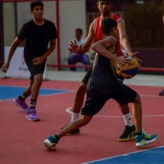 A young player skillfully maneuvers the ball under pressure from a defender. My Junior Basketball League is designed to test and improve every player's ball-handling skills.