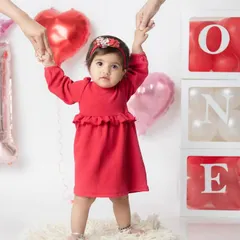 Taking her very first steps into year one! I love capturing these huge milestones during a first birthday photoshoot.