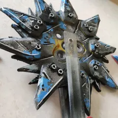 A detailed look at the Buzz-axe prop I built for my Krieg cosplay from Borderlands. I used a ruler to show the scale and the intricate, weathered paint job.