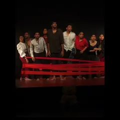 From classroom exercises to the main stage, our work culminates in powerful, original theatre productions. This is a moment from our dance-theatre piece, 'Sea's Fire', where students bring their training and passion to a live audience.