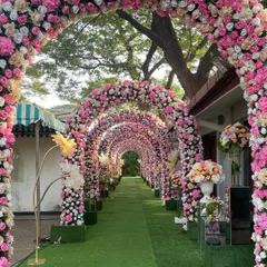 Another perspective of the magnificent floral tunnel, showing the sheer abundance of flowers used to create this immersive and luxurious walkway.