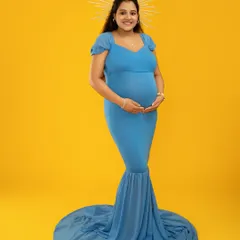 I love playing with color and artistic props to reflect your personality. This shot uses a vibrant yellow backdrop and a celestial halo to create a modern, divine look for this mother-to-be.