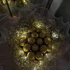 Imagine their face when they see this. I arrange luxurious Ferrero Rocher chocolates in a cloud of baby's breath and weave in delicate fairy lights to create a truly magical and edible gift, perfect for a memorable first date or anniversary.