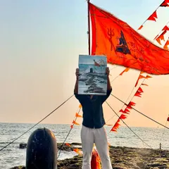 Holding my finished painting in front of the real location at Somnath. This is what 'en plein air' painting is all about.
