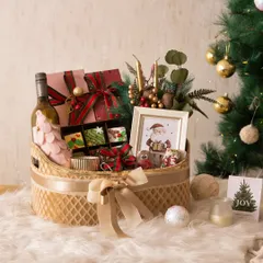 Our Christmas Feast Hamper is the ultimate festive indulgence. It's a huge basket filled with everything from wine and coated strawberries to brownies, cookies, and chocolate bombs.