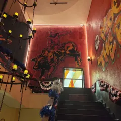 I bring the heat to commercial spaces. This desert-themed mural, complete with a bucking bronco, completely transformed the staircase of this cafe, creating an immersive experience for customers from the moment they walk in.