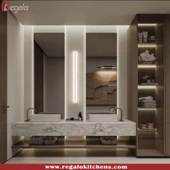 A double vanity with a floating marble counter and open lower shelf for towel storage. The design includes a full-height cabinet with illuminated shelving for toiletries.