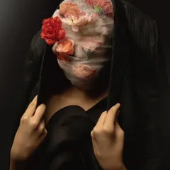 An anonymous portrait from a surrealist series, where the identity is obscured by flowers and gauze. This piece explores themes of beauty, identity, and the masks we wear.