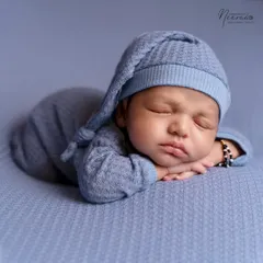 That little pout is just everything. I focus on capturing these fleeting expressions and tiny details, like the bracelet on his wrist, that make your baby unique.