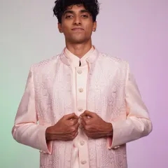From meh to 'WOW' in one rental. This pastel pink Indo-Western set proves that real men wear pink and look amazing doing it.