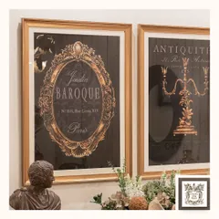 This shot highlights the versatility of a classic wooden cabinet. It provides a beautiful surface for displaying decorative items like a bust sculpture, a unique clam shell planter, and vintage-style wall art.
