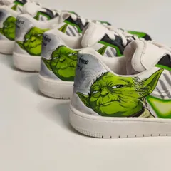 A lineup of the 'Jedi' side of the mismatched pair, featuring detailed portraits of Yoda. Each pair was meticulously hand-painted to be a true collector's item for Star Wars fans.