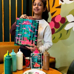 A proud young artist with her mystical forest painting. It's wonderful to see participants add their own creative touches to the theme of the day.