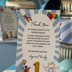 A close-up of the personalized thank you card from the Agarwal family, a thoughtful detail included in the first birthday favors.