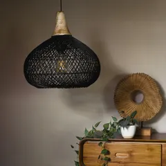 The same black bamboo pendant shown unlit. This allows you to see the contrast between the matte black finish and the natural wood accent, a detail that adds sophisticated character.