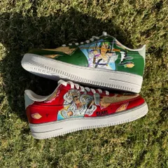 A top-down view of the custom One Piece sneakers, showing the contrast between the two powerful characters.