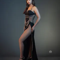 A perfect example of a clean, high-impact studio portrait. I used controlled lighting to sculpt the model's form, emphasizing the lines of the black gown and the strength of the pose. This is the kind of sharp, modern fashion shot I specialize in.