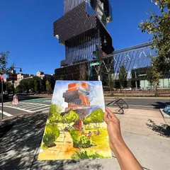 My finished watercolour painting of the stunning "Jenga Building" at Boston University, held up against the clear blue sky. It was a challenge to capture this unique piece of modern architecture.