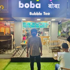Our graduate Vishal, standing in front of his newly opened bubble tea and coffee shop in Pune. It's an incredible feeling to see our students turn their training into a tangible business.