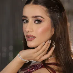 A close-up of a glamorous cocktail look. I focused on creating luminous, dewy skin, soft smokey eyes with a hint of sparkle, and a perfectly defined nude lip to achieve that sophisticated, camera-ready finish.