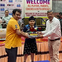 And this is the result of that focus. Here is my 8-year-old player, Mehransh Singh Bhatia, proudly receiving his silver medal at the 1st Delhi State Ranking Tournament. Hard work always pays off.