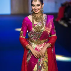 Capturing the energy of the runway for the show stopper at Bangalore Times Fashion Week. This shot highlights the rich colors and textures of the traditional South Indian attire under professional show lighting.
